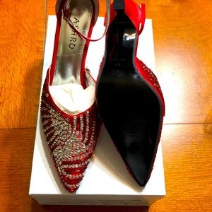 Red Spiral Glitz shoe. Never been worn